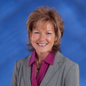 Portrait of Searle Starter, a professional team member at Coast Fiduciary, showcasing expertise in financial planning and client service.